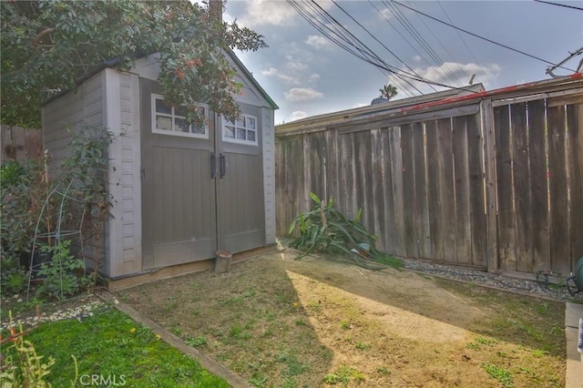 view of shed with fence