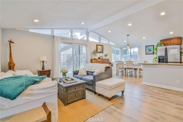 living area with vaulted ceiling with beams, light wood-style flooring, and recessed lighting