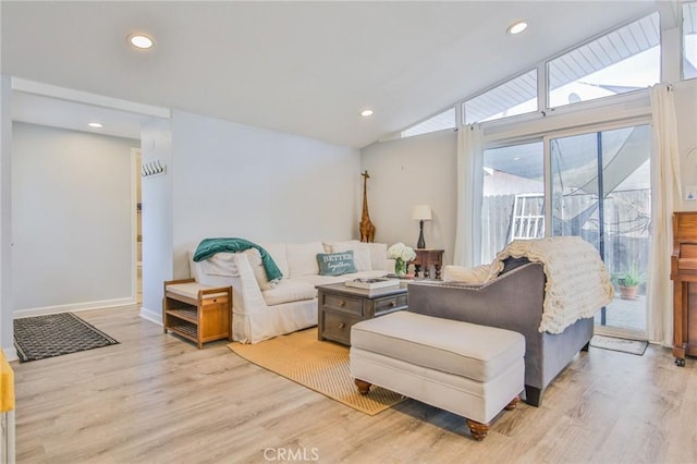 living room with light wood-style flooring, baseboards, vaulted ceiling, and recessed lighting