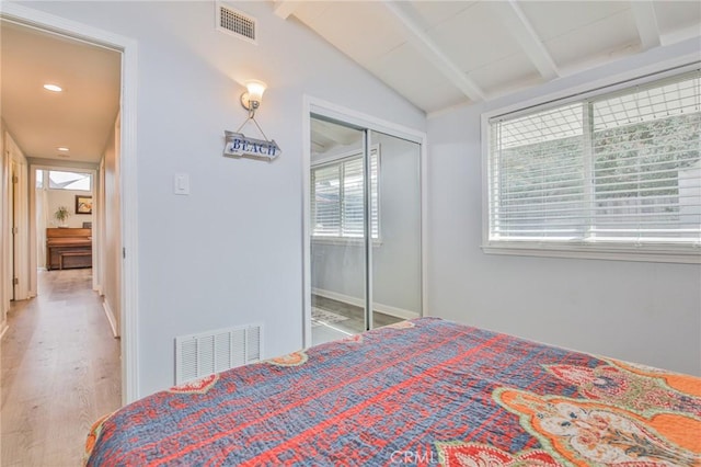 bedroom with lofted ceiling with beams, visible vents, wood finished floors, and recessed lighting