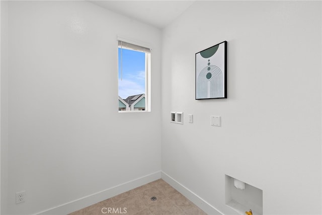 clothes washing area with washer hookup, laundry area, and baseboards