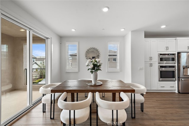 dining area featuring dark wood-style floors and recessed lighting