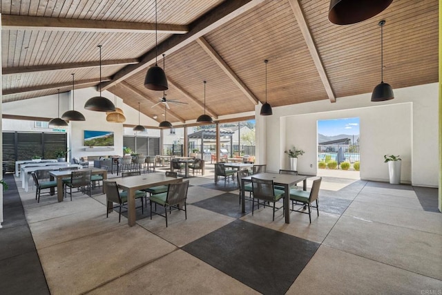 view of patio featuring outdoor dining area and a ceiling fan