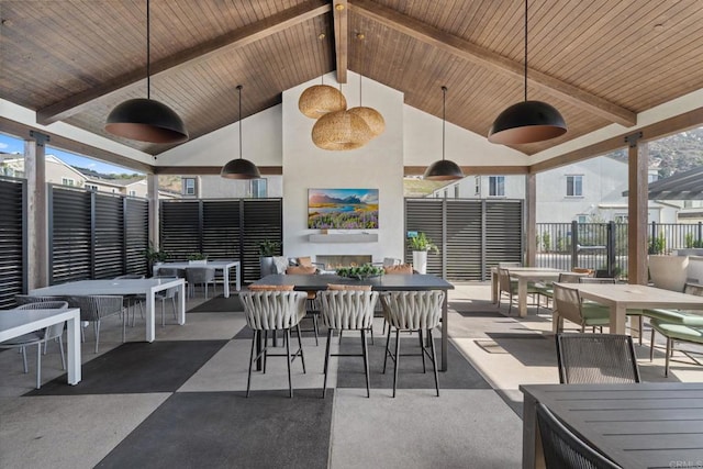 view of patio / terrace featuring ceiling fan, fence, and outdoor dining space