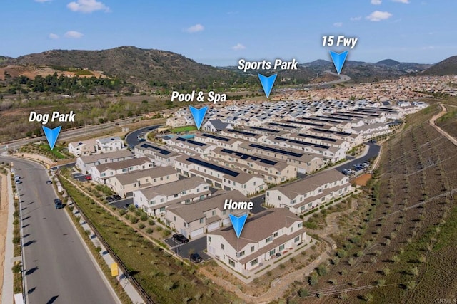 birds eye view of property with a mountain view