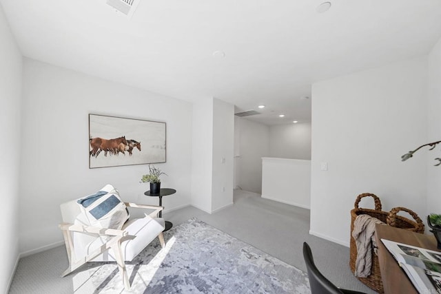 living area featuring carpet floors, recessed lighting, visible vents, an upstairs landing, and baseboards