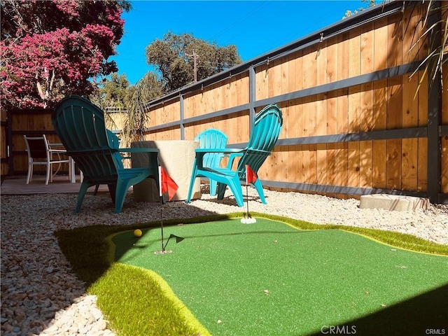 view of jungle gym featuring a fenced backyard