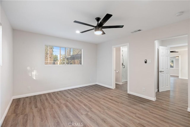 unfurnished bedroom with baseboards, visible vents, and wood finished floors