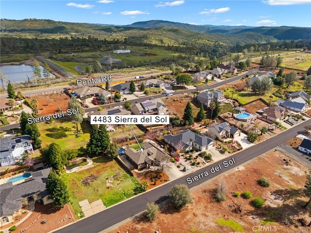 birds eye view of property with a residential view and a water and mountain view