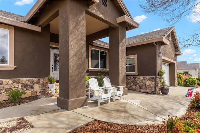 view of patio / terrace with an attached garage