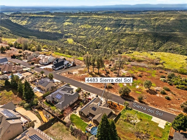 bird's eye view featuring a residential view and a mountain view