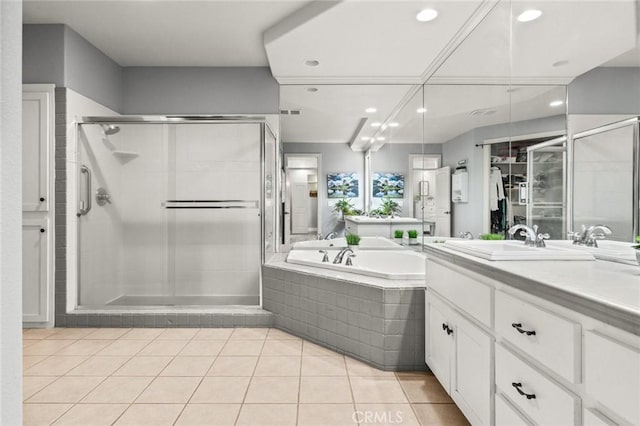 full bath featuring a garden tub, recessed lighting, a shower stall, vanity, and tile patterned flooring