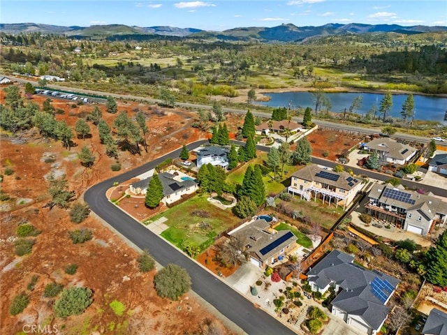 birds eye view of property featuring a residential view and a water and mountain view