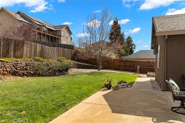 view of yard with a patio and a fenced backyard