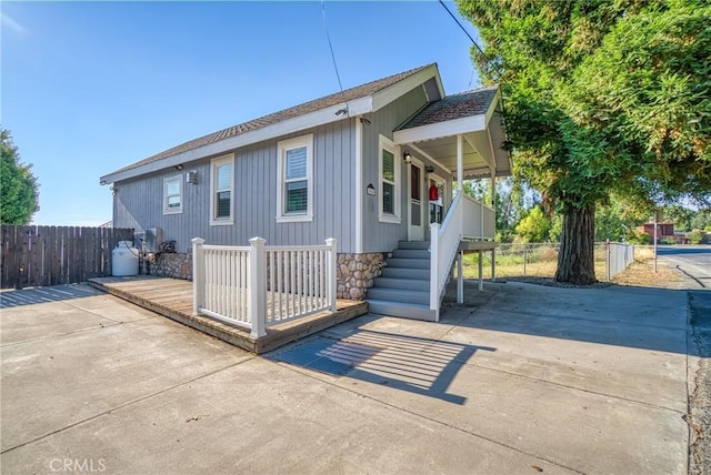 exterior space featuring fence and a wooden deck