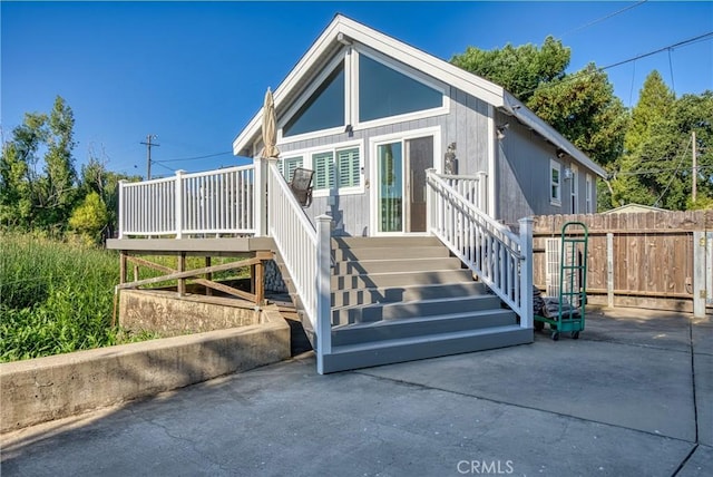 view of front of property featuring fence