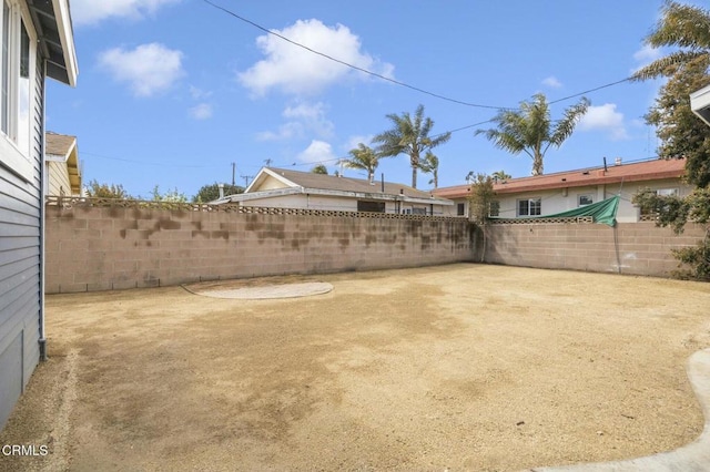 view of yard with a fenced backyard