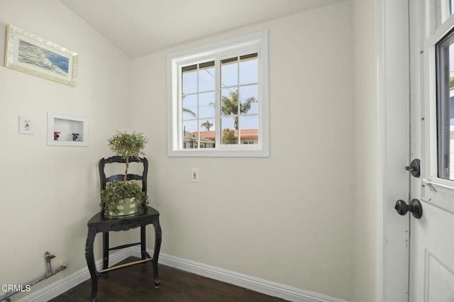 interior space with hookup for a washing machine, baseboards, dark wood-style floors, and laundry area