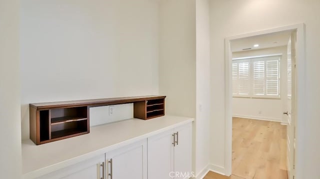 interior space with light wood-style flooring and baseboards