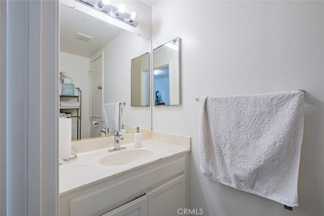 bathroom featuring visible vents and vanity