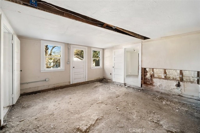 interior space featuring beamed ceiling