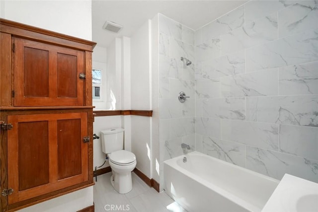 bathroom featuring visible vents, tub / shower combination, toilet, and baseboards