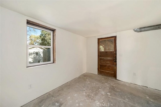 empty room featuring unfinished concrete floors