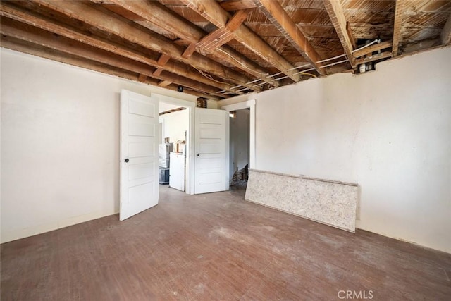 spare room featuring wood finished floors