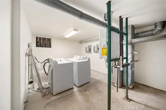 clothes washing area with laundry area and independent washer and dryer