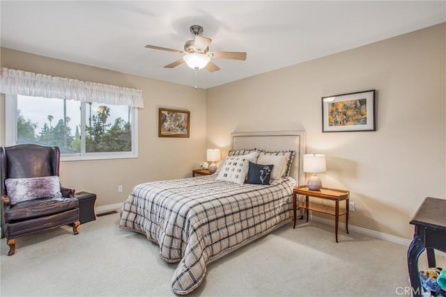 bedroom with carpet floors, ceiling fan, visible vents, and baseboards