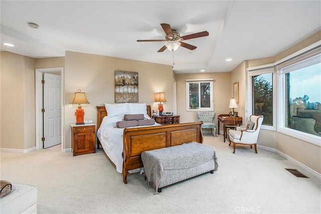 bedroom with light colored carpet, visible vents, baseboards, and recessed lighting