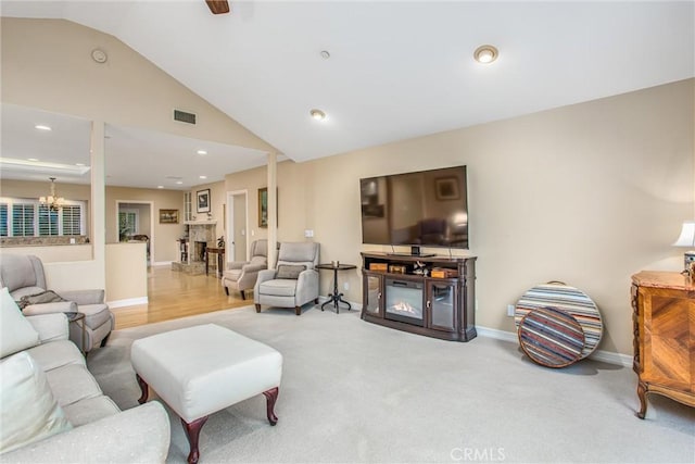 living area with carpet floors, a fireplace, recessed lighting, visible vents, and baseboards