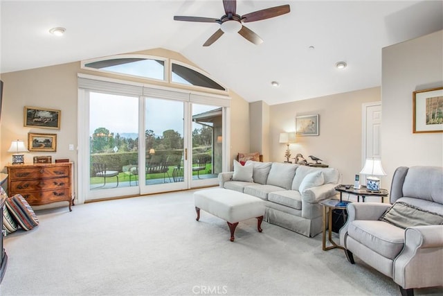 carpeted living area with vaulted ceiling and ceiling fan