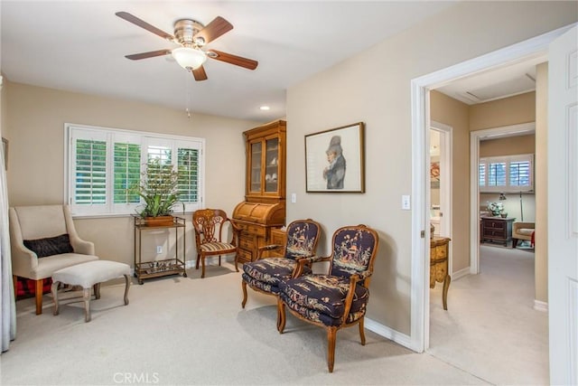 living area featuring recessed lighting, light carpet, ceiling fan, and baseboards