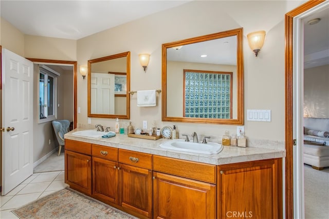 bathroom featuring double vanity, tile patterned flooring, and a sink