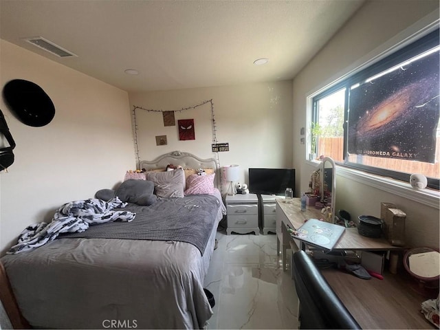 bedroom featuring marble finish floor and visible vents