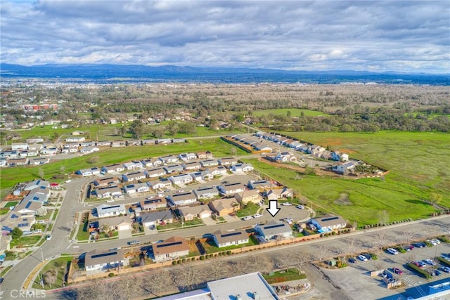 birds eye view of property featuring a mountain view