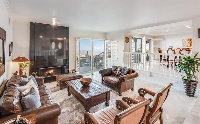 living area with visible vents and a large fireplace