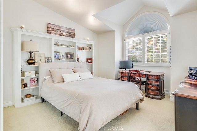 bedroom featuring carpet floors and vaulted ceiling