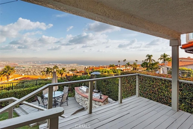 deck featuring outdoor dining area