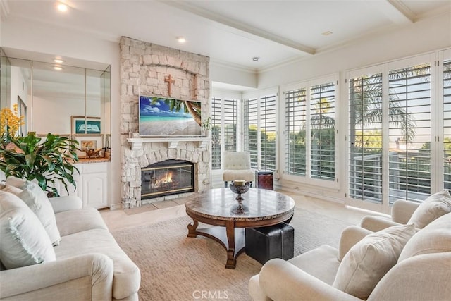 living room featuring recessed lighting, beam ceiling, crown molding, and a stone fireplace