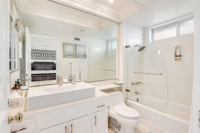 bathroom featuring crown molding, washtub / shower combination, vanity, toilet, and visible vents