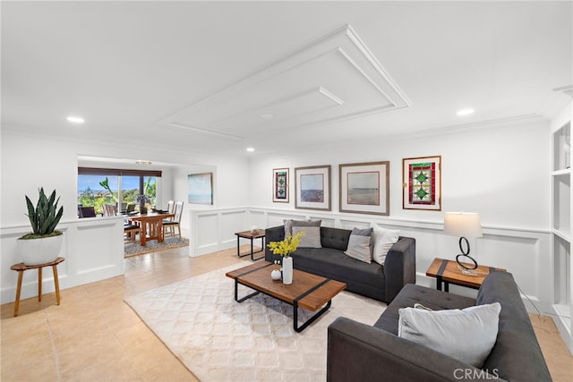 living area with a wainscoted wall, recessed lighting, light tile patterned flooring, crown molding, and a decorative wall