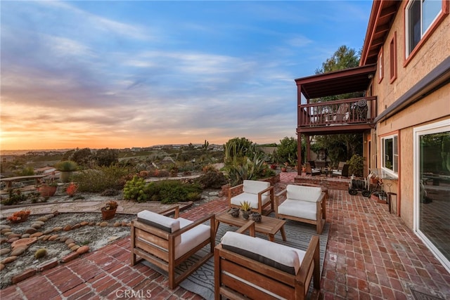 view of patio featuring an outdoor living space and a balcony