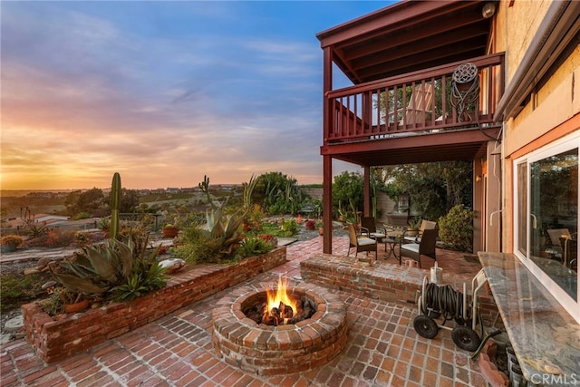 view of patio featuring a fire pit and outdoor dining area