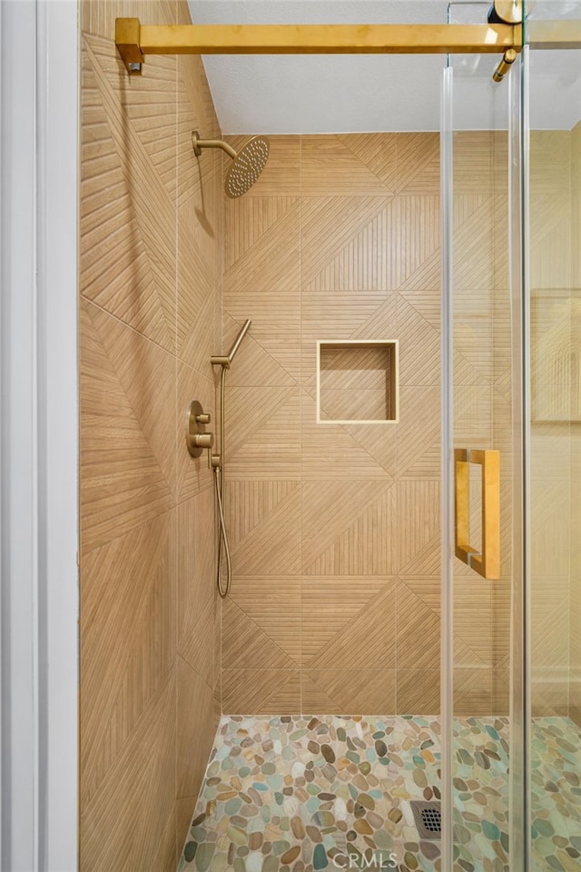 bathroom with a stall shower