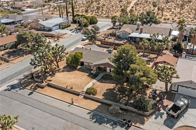 birds eye view of property with a residential view