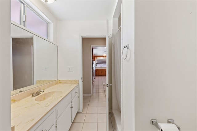 bathroom with tile patterned flooring and vanity