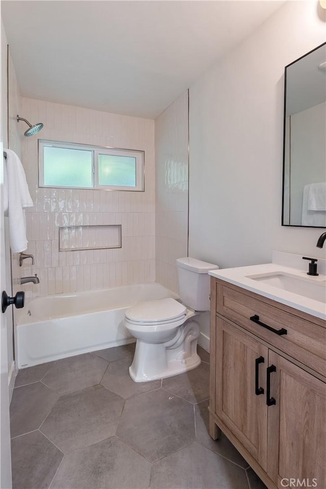 bathroom featuring bathing tub / shower combination, vanity, toilet, and tile patterned floors