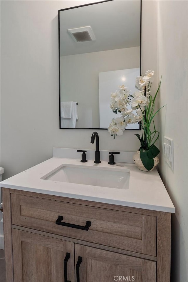 bathroom featuring visible vents and vanity